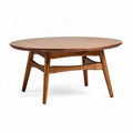 Round oak coffee table with open shelf design 39 inches diameter